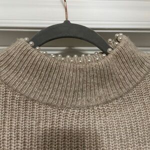 Sweater with pearl neck detail